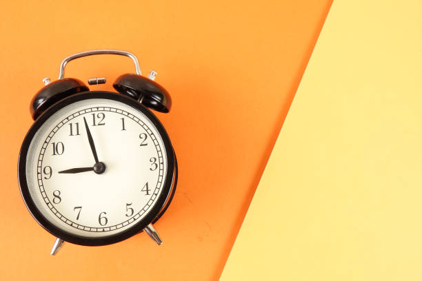 istock Time Punctuality Concept with black alarm clock. 1176250187