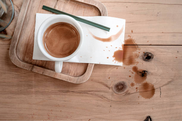 istock Cup of coffee on wooden table with coffee stains. 1176252803
