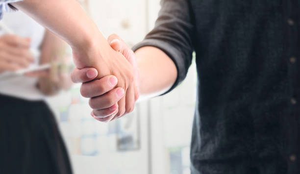 istock Closeup view business people shaking hands. 1176253797