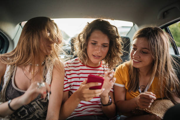 istock Woman reading messages with her friends 1176263523