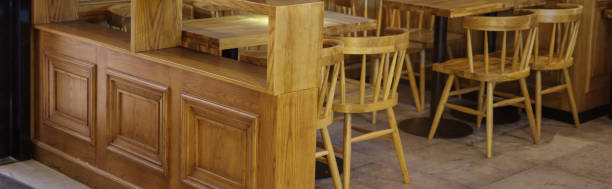 istock Yellow wood chairs and tables in empty restaurant 1176264486