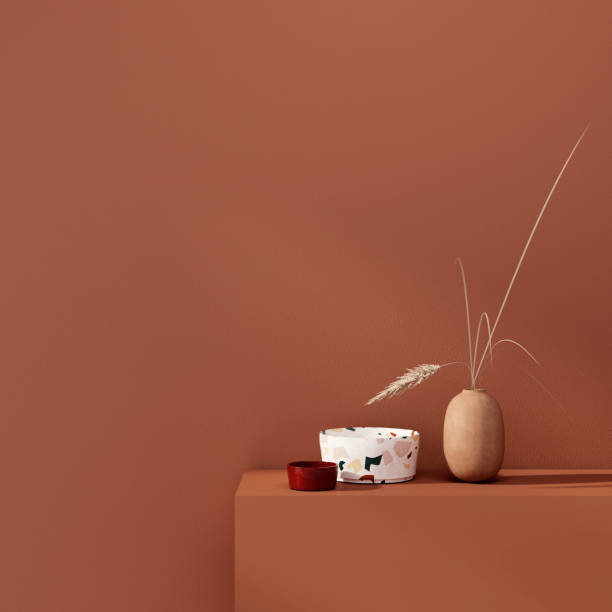 Interior decoration with vases  on a background of a teracotta wall