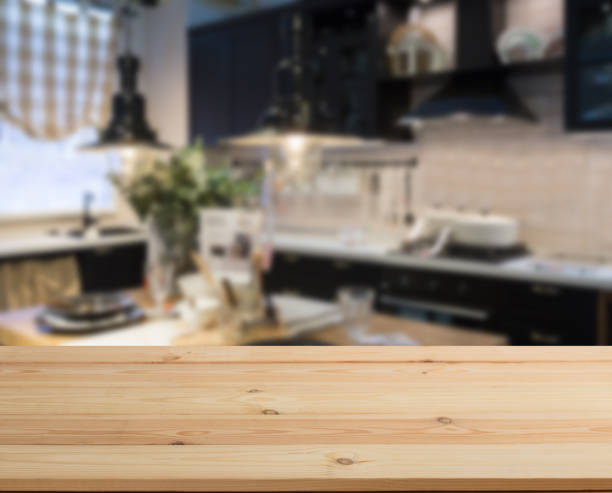 wooden table top and blur kitchen room of the background - domestic kitchen kitchen sink contemporary counter top imagens e fotografias de stock