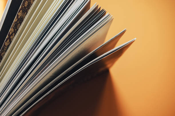 istock Close up Beautiful new book on a orange background. Top view. 1176271556