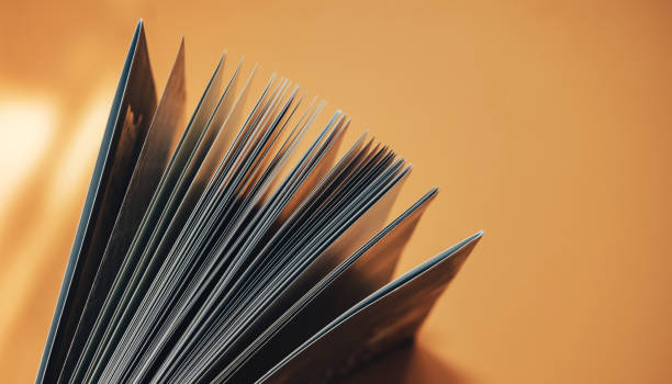 istock Beautiful new book on a orange background. Top view. 1176272152