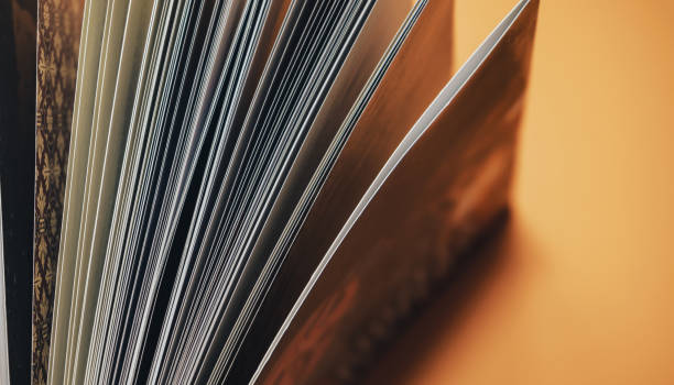 istock Close up Beautiful new book on a orange background. Top view. 1176272199