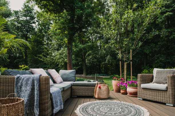 istock Garden patio decorated with Scandinavian wicker sofa and coffee table 1176272267