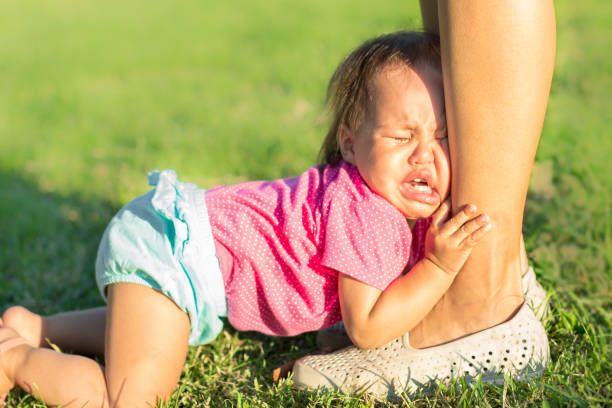 mother ignoring her baby crying. - displeased child abandoned child abuse imagens e fotografias de stock