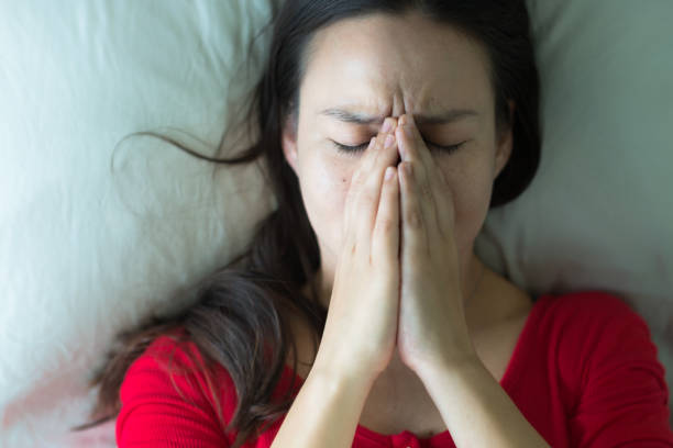 istock Stressed sad woman covering her face. 1176272357