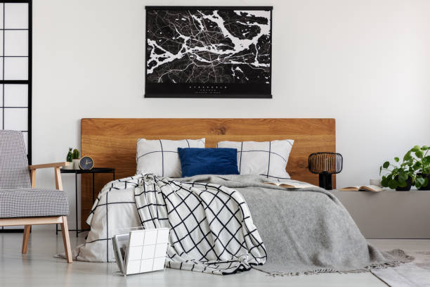 istock Elegant bedroom with white wall and chequered bedding 1176273392