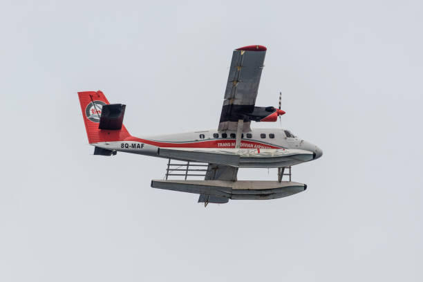 Aircraft De Havilland Canada DHC-6-300 Twin Otter of the Trans Maldivian Airways Male, Maldives - November 16, 2017: Maldivian Air Taxi airplane De Havilland Canada DHC-6-300 Twin Otter of the Trans Maldivian Airways flying in cloudy weather in Male, Maldives Islands, Indian Ocean. de havilland dhc 6 twin otter stock pictures, royalty-free photos & images