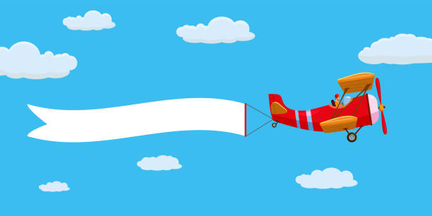 istock Red retro airplane aircraft with advertising banner ribbon in the cloudy sky. Vector isolated illustration 1176273517