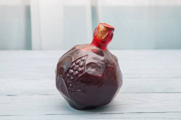 A bottle of  armenian pomegranate wine on wooden table