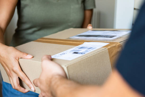 istock Home delivery of a box to the client 1176281117