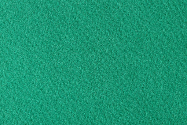 istock Textured dark green paper as background. Can be used as texture in art projects. 1176284714