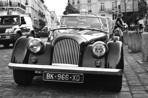 Paris, France - August 22th 2017 : Beautiful Morgan Plus 4 parked in a street in Paris, near Saint-Germain-des-prés.