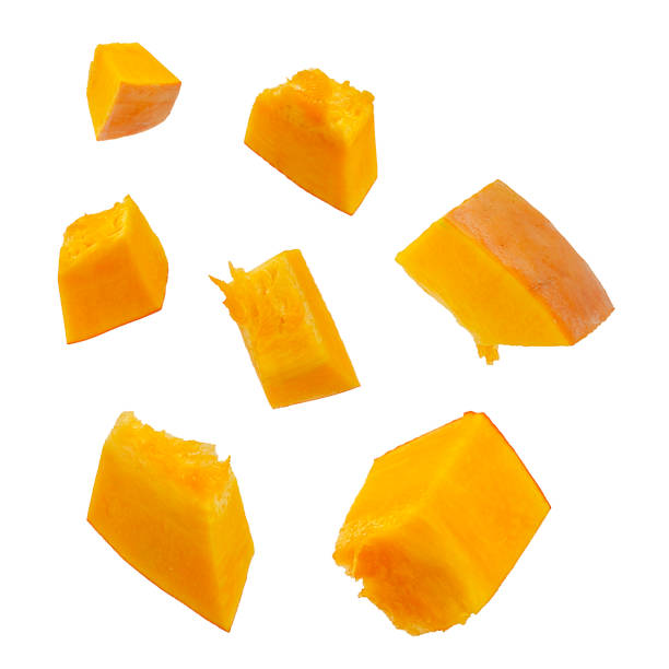 istock Pumpkin slices isolated on a white background, top view. Sliced pumpkin isolated on white. Pieces of pumpkin, top view. Diced pumpkin, closeup. 1176290759