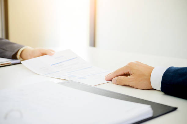 istock Interview  about to sign a legal document which would be a binding mutual agreement 1176291095