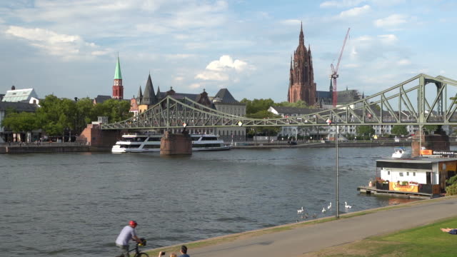 Frankfurt cathedral and Eiserner steg (Iron bridge) on the river Main - 4k video
