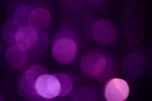 istock Bokeh. Holiday background. Christmas lights. Glitter. Defocused sparkles. New Year backdrop. Festive wallpaper. Blinks. Carnival. Tinsel. Bokeh retro style photo. Violet. Purple. 1176293691