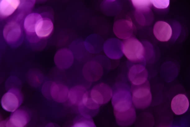 istock Bokeh. Holiday background. Christmas lights. Glitter. Defocused sparkles. New Year backdrop. Festive wallpaper. Blinks. Carnival. Tinsel. Bokeh retro style photo. Violet. Purple. 1176293710
