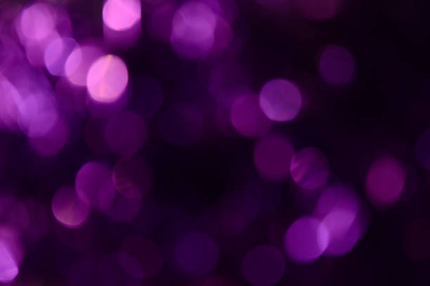 istock Bokeh. Holiday background. Christmas lights. Glitter. Defocused sparkles. New Year backdrop. Festive wallpaper. Blinks. Carnival. Tinsel. Bokeh retro style photo. Violet. Purple. 1176293713