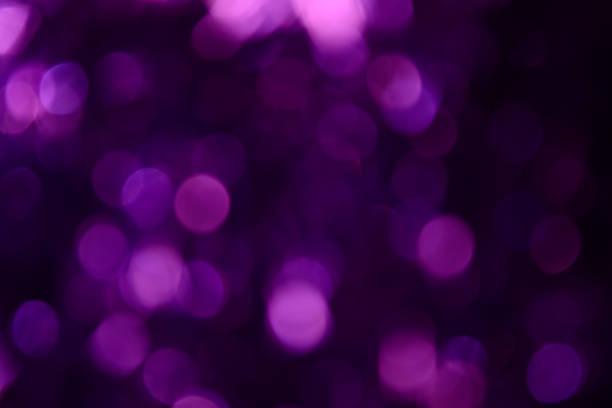 istock Bokeh. Holiday background. Christmas lights. Glitter. Defocused sparkles. New Year backdrop. Festive wallpaper. Blinks. Carnival. Tinsel. Bokeh retro style photo. Violet. Purple. 1176293730