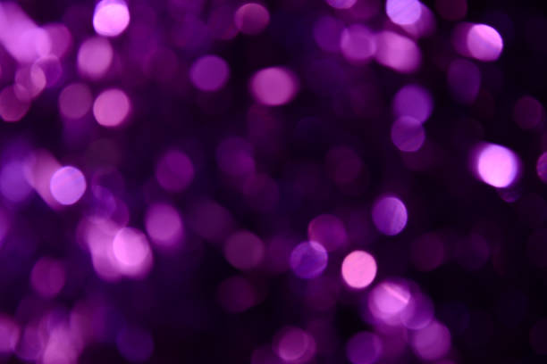 istock Bokeh. Holiday background. Christmas lights. Glitter. Defocused sparkles. New Year backdrop. Festive wallpaper. Blinks. Carnival. Tinsel. Bokeh retro style photo. Violet. Purple. 1176293737