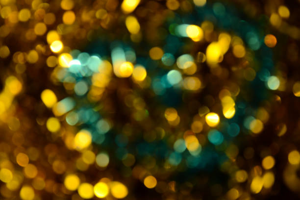 istock Bokeh. Holiday background. Christmas lights. Glitter. Defocused sparkles. New Year backdrop. Festive wallpaper. Blinks. Carnival. Tinsel. Bokeh retro style photo. Golden. Gold. 1176294495
