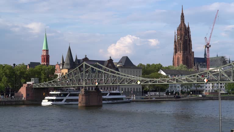 Frankfurt cathedral and Eiserner steg (Iron bridge) on the river Main - 4k video