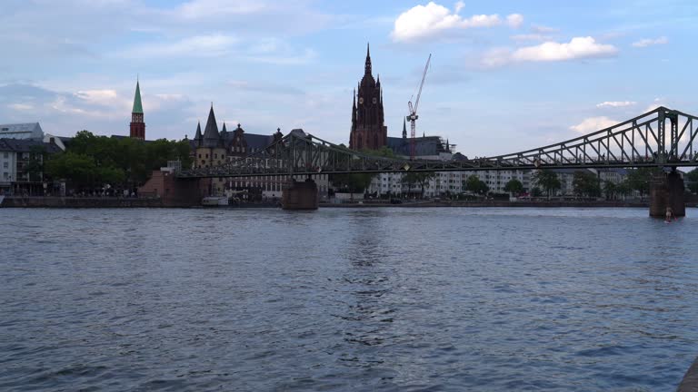 Frankfurt cathedral and Eiserner steg (Iron bridge) on the river Main - 4k video