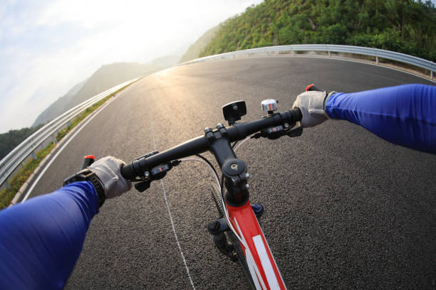 istock Cyclist riding a bike on highway 1176295854