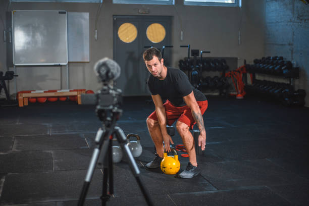 istock Fitness Trainer Showing Proper Form for Kettlebell Lifting 1176295999