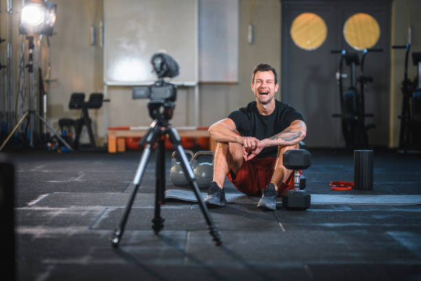 istock Laughing Male Athlete Getting Ready to Film Gym Tutorial 1176296006