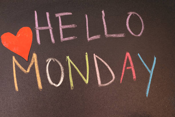 istock handwriting hello monday on chalkboard with colorful chalk and heart paper 1176297486