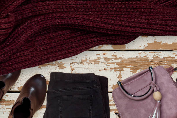istock woman collection:  boots withs and pink shoulder bag, jeans, winter scarf 1176298971