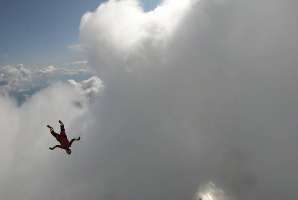 istock Skydiver falls through clear skies, in aerial flight 1176299948