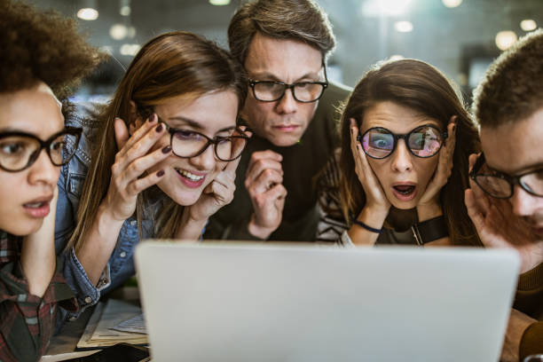 istock Team of nerdy entrepreneurs reading an e-mail on laptop in the office. 1176299972