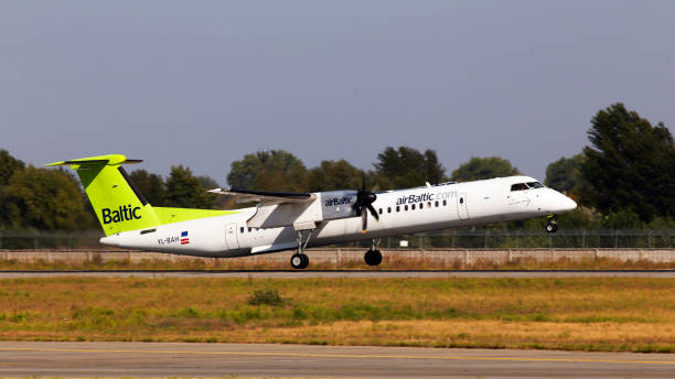 yl-bah air baltic bombardier dhc-8-400 aircraft departing from the borispol international airport - fuel and power generation air vehicle repairing airplane imagens e fotografias de stock