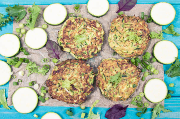 istock Zucchini pancakes with chives on a wooden table. 1176301270