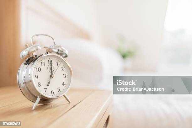 Alarm Clock Morning Wakeup Time Stock Photo - Download Image Now - Alarm Clock, Sleeping, Night Table