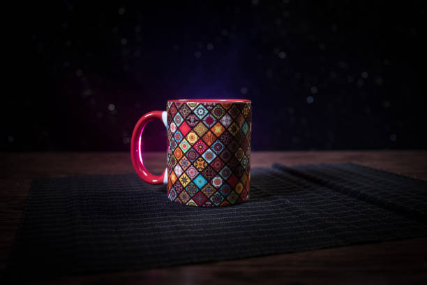 istock Beautiful eastern style textured ceramic cup of coffee (or tea) with smoke over dark toned background. 1176303154