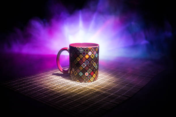 istock Beautiful eastern style textured ceramic cup of coffee (or tea) with smoke over dark toned background. 1176303161