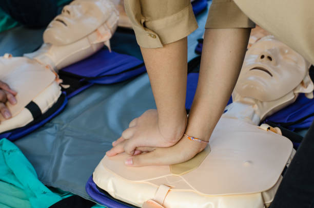 istock CPR training chest compressions for first aid  in emergency. 1176306331