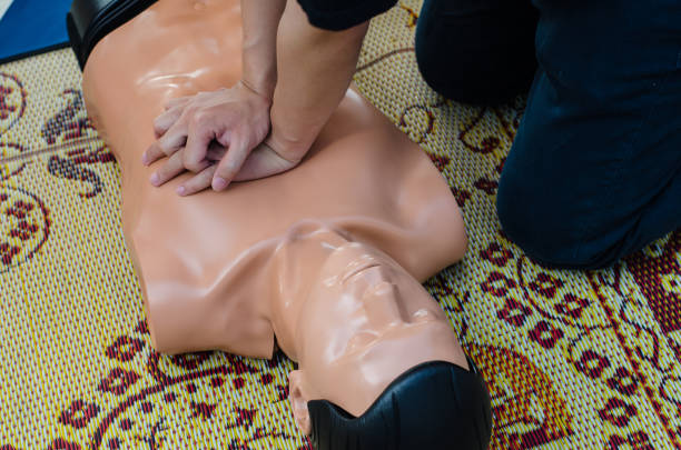 istock CPR training chest compressions for first aid  in emergency. 1176306366