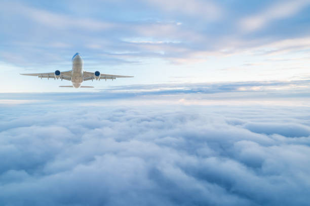 passenger airplane on the clouds background. flight in stratosphere. - cloud cloudscape stratosphere above imagens e fotografias de stock