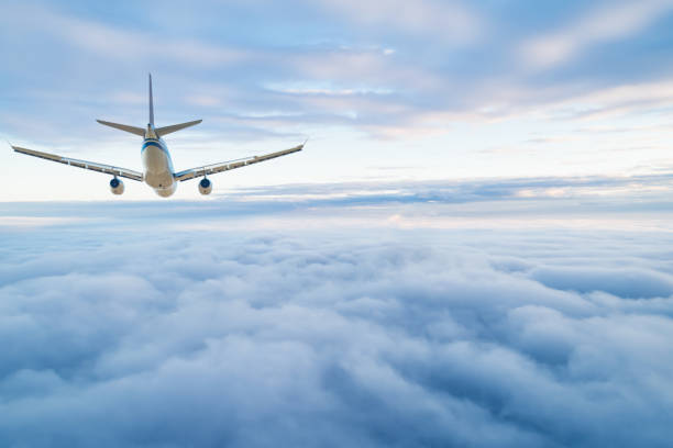 passenger airplane on the clouds background. flight in stratosphere. - cloud cloudscape stratosphere above imagens e fotografias de stock