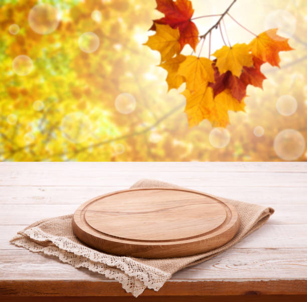 istock Pizza board with tableclothe on wooden desk. Autumn background. Top view mock up. Selective focus. 1176313018