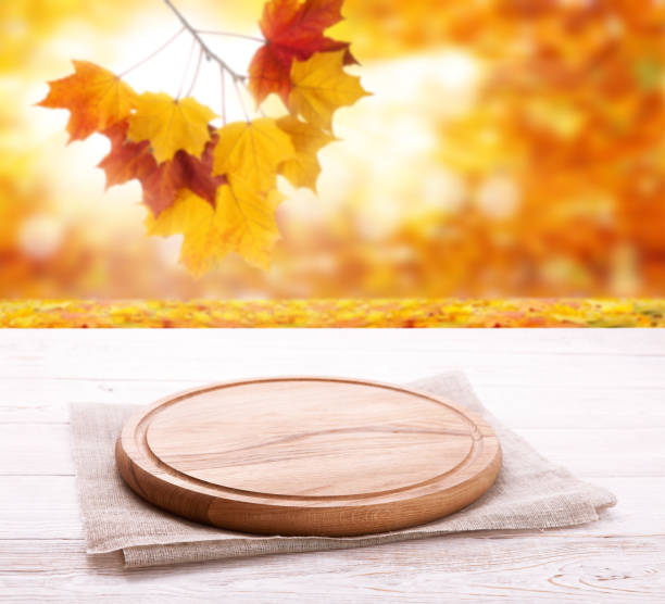 istock Pizza board with tableclothe on wooden desk. Autumn background. Top view mock up. Selective focus. 1176313034