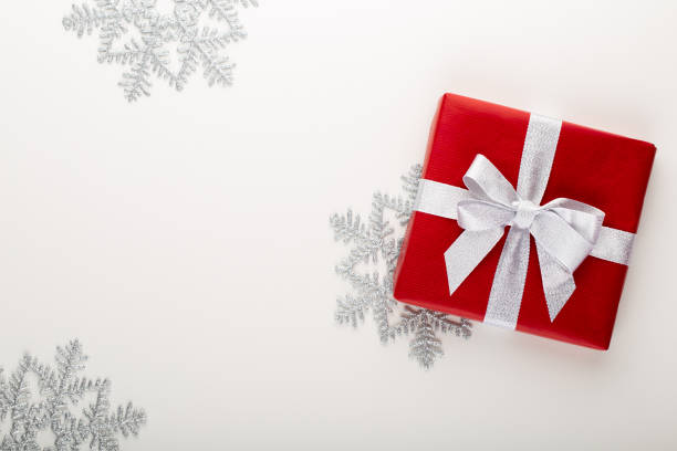 istock Gift or present box and stars confetti on color table top view. Flat lay composition for birthday, mother day or wedding. 1176313181